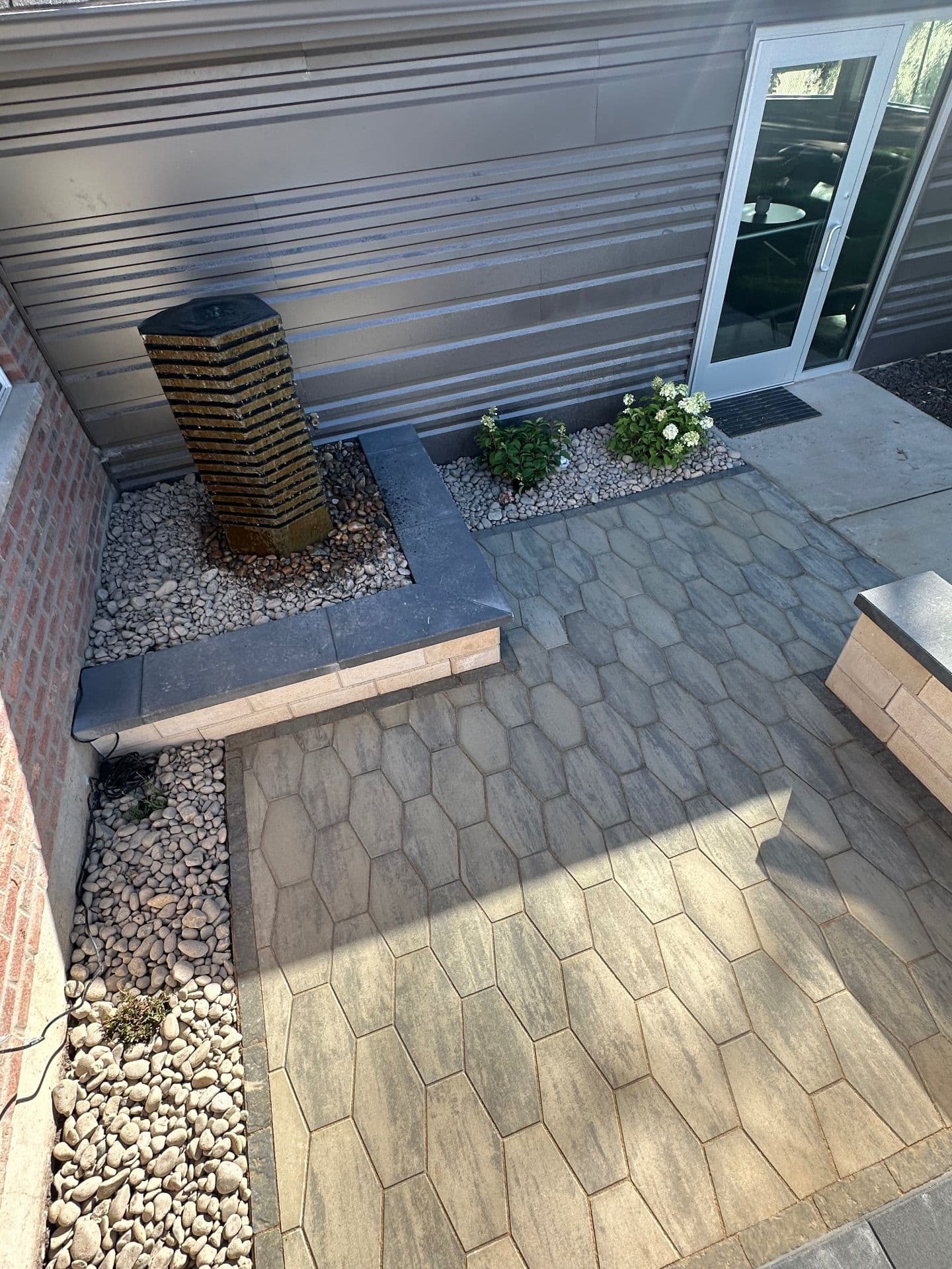Hexa Pavers and Rock Features Revamp Outdoor Space image