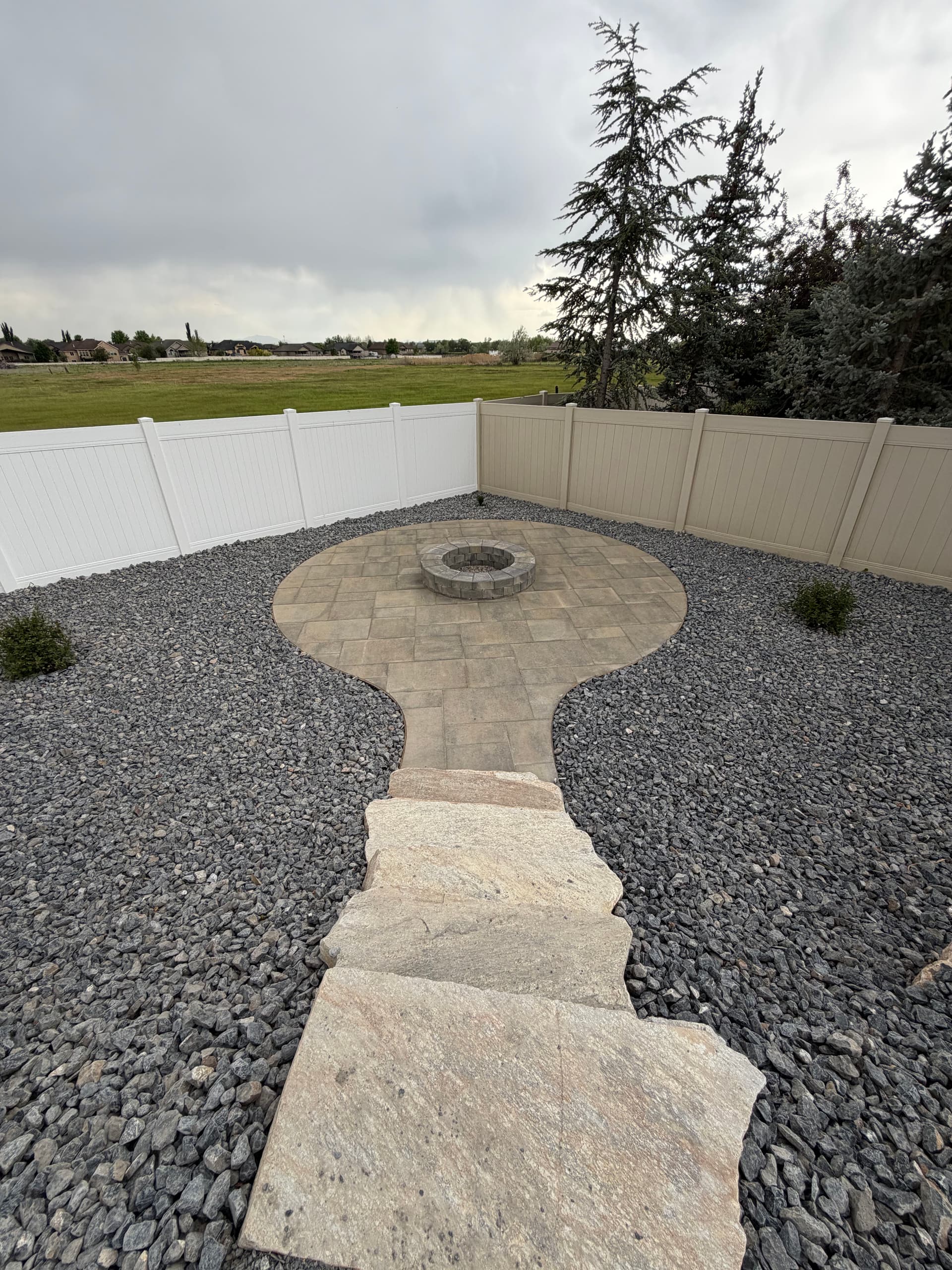 Gallery photos for Backyard Fire Pit Paver Patio and Xeriscape Build in Pleasant View: Image #3
