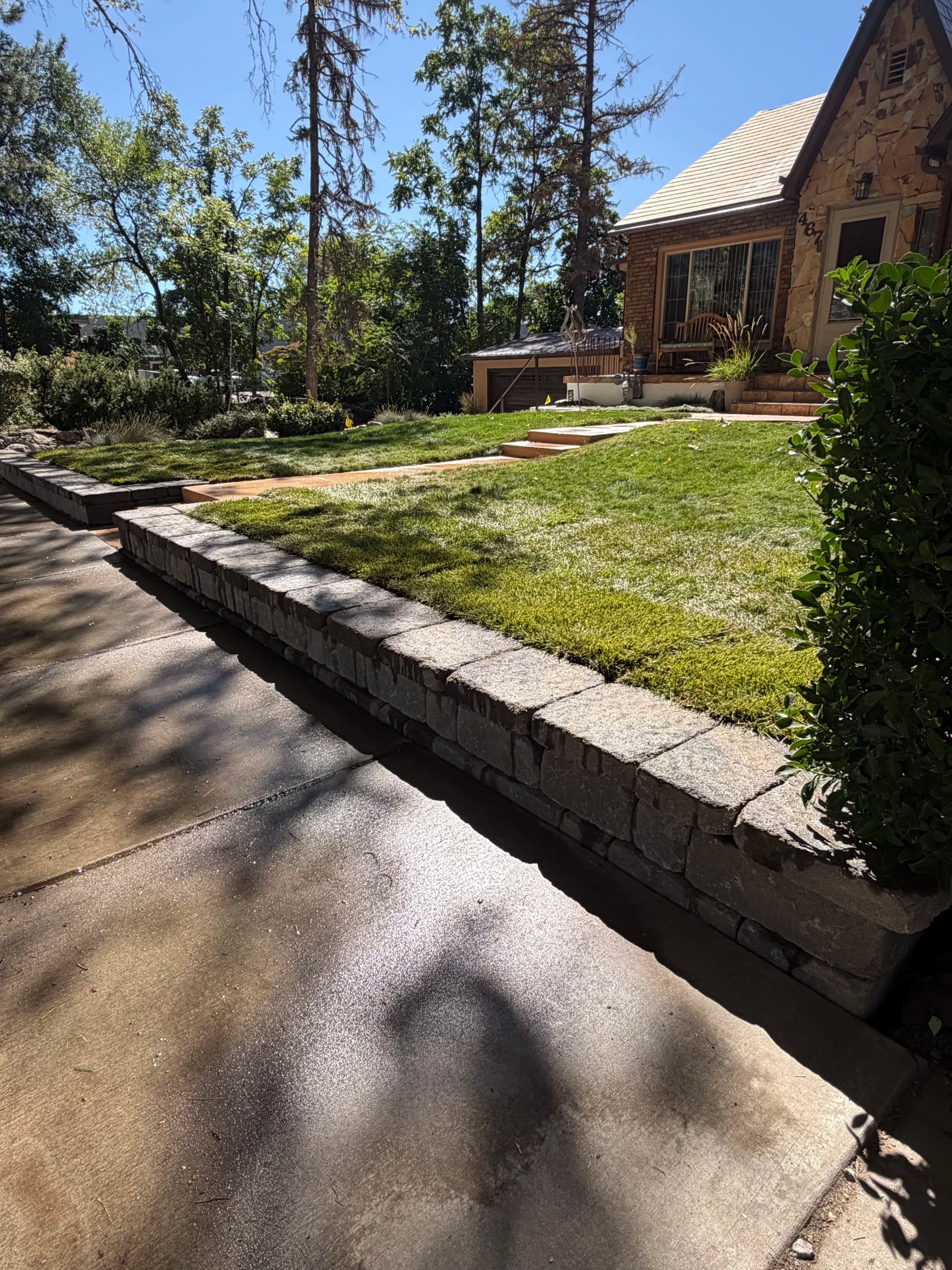 Block Wall and Sod Turn a Sloped Front Yard Into Usable Space image